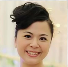 Smiling bride with softly defined makeup and an updo